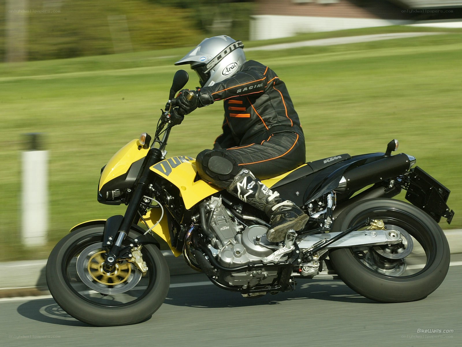 racing on a yellow motorcycle