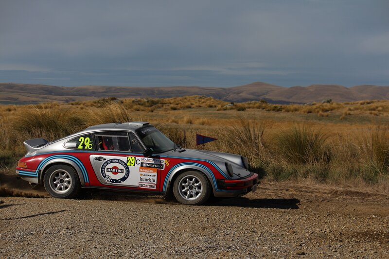 Racing Porsche on a dirt track