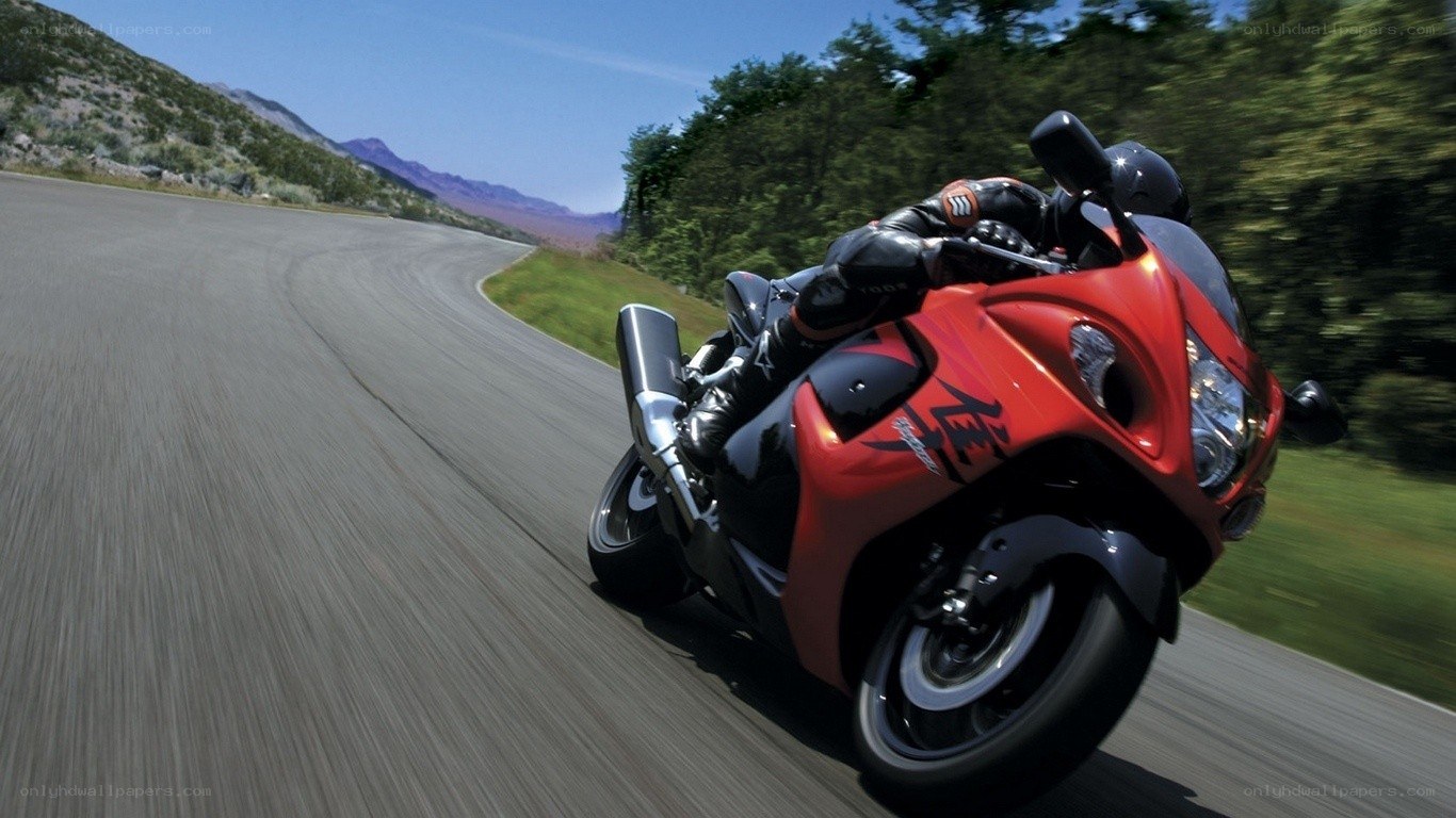 racing red motorcycle on road