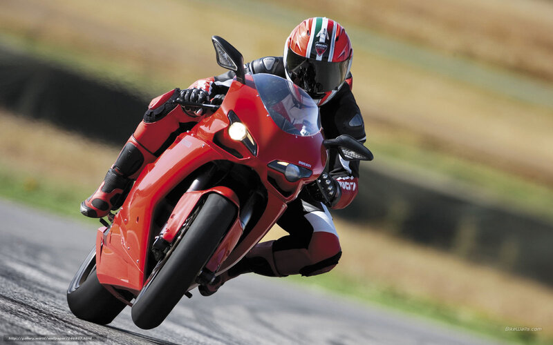 racing red motorcycle on track