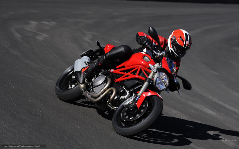 racing red motorcycle on track
