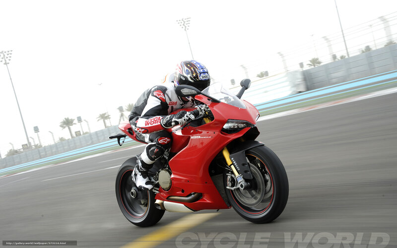 racing red motorcycle on track