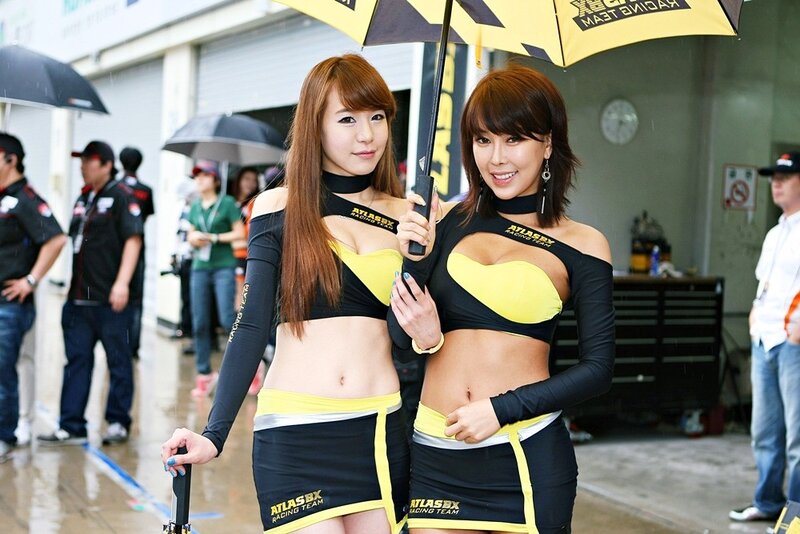 Racing team models at event