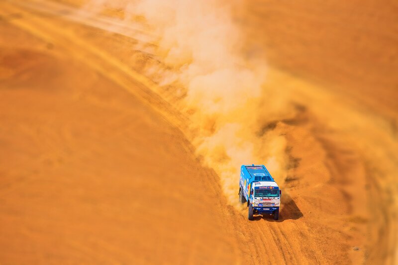 Racing Truck in Desert — Orange, Dynamic, Afternoon