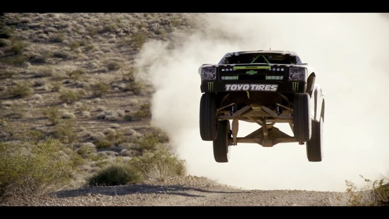 Racing Truck in Mid-air — Brown, Action-packed