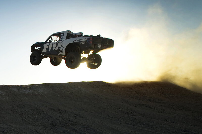 Racing Truck in Mid-air — Brown, Dramatic