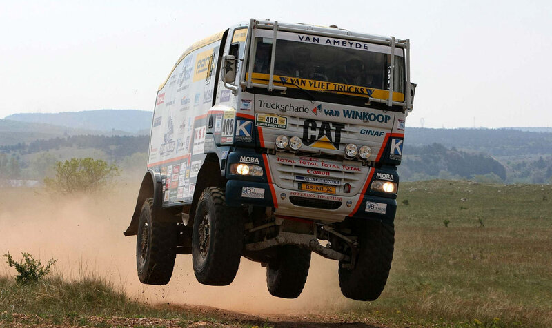 racing truck in mid-air jump