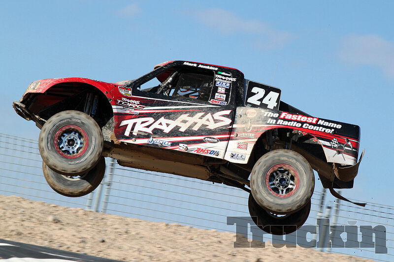 Racing Truck in Mid-air — Red