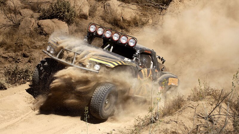 racing truck kicking up dust