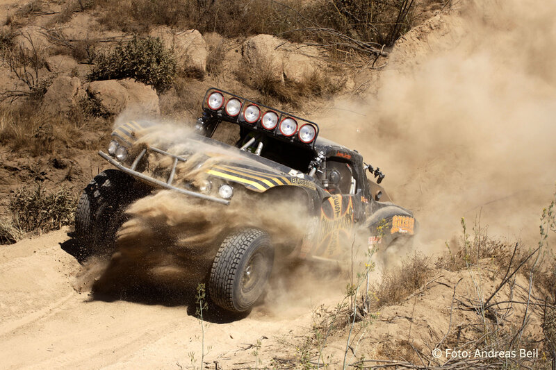 Racing truck on dusty terrain