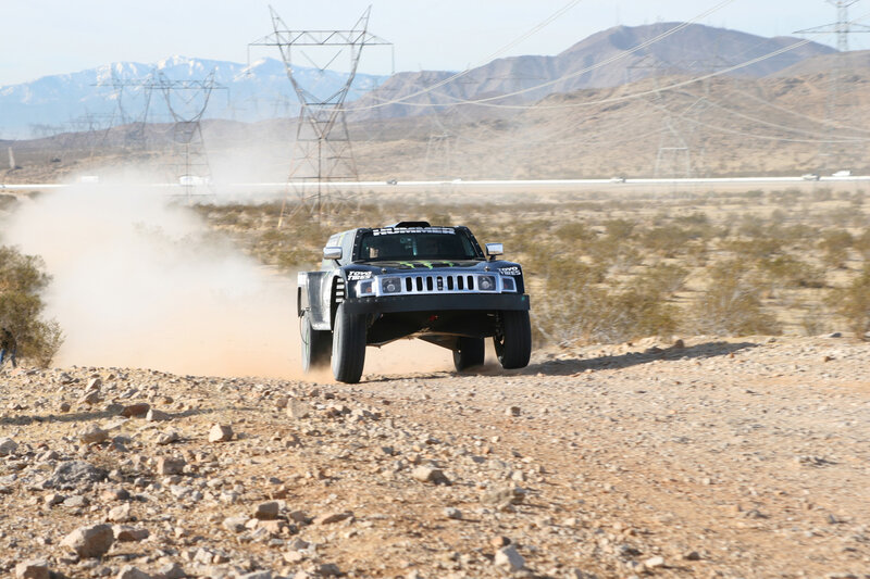 Racing truck on dusty terrain