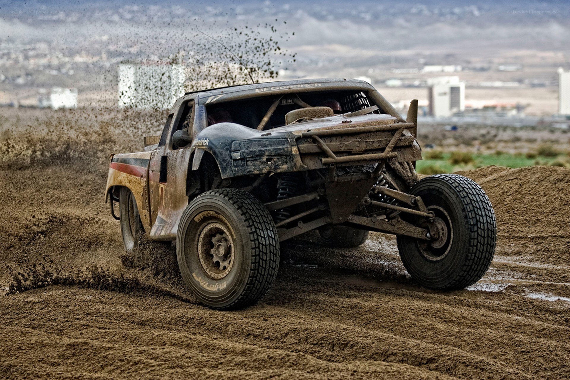 Racing truck on muddy track