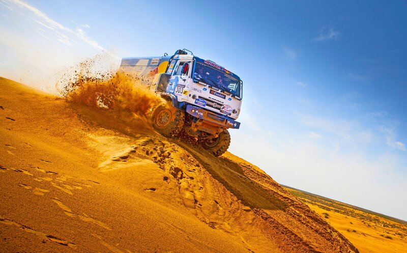 Racing Truck on Sand Dune — Orange