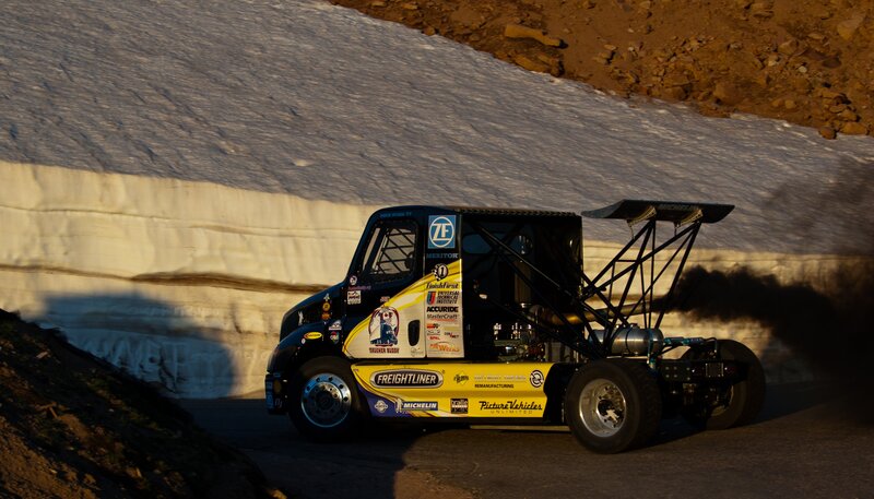 racing truck on snowy mountain road