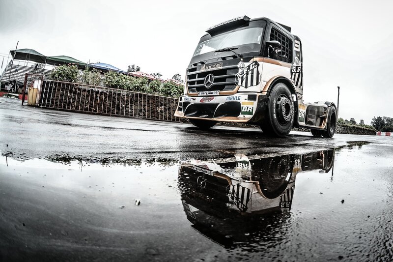 Racing Truck on Wet Pavement