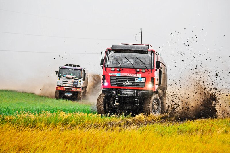 Racing Trucks in Field