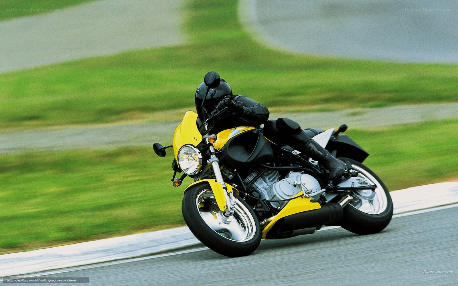 racing yellow motorcycle on track