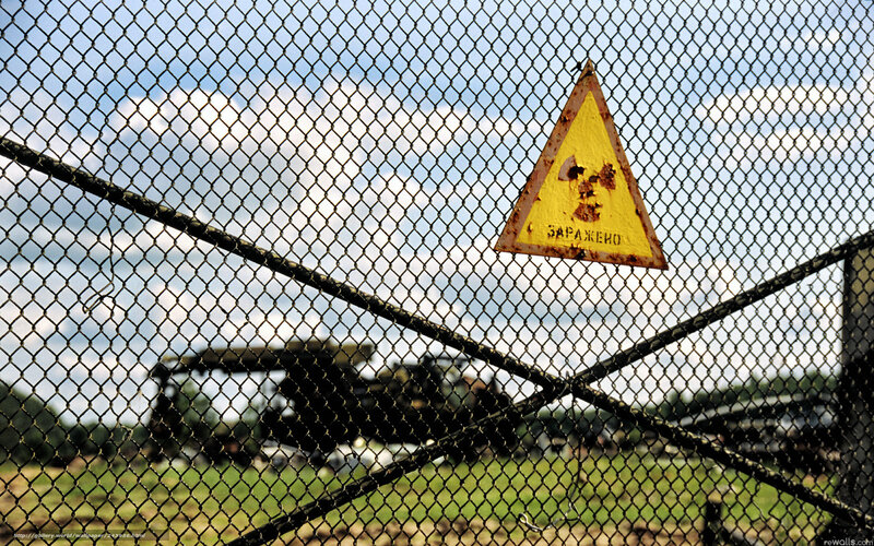 Radiation warning sign behind fence