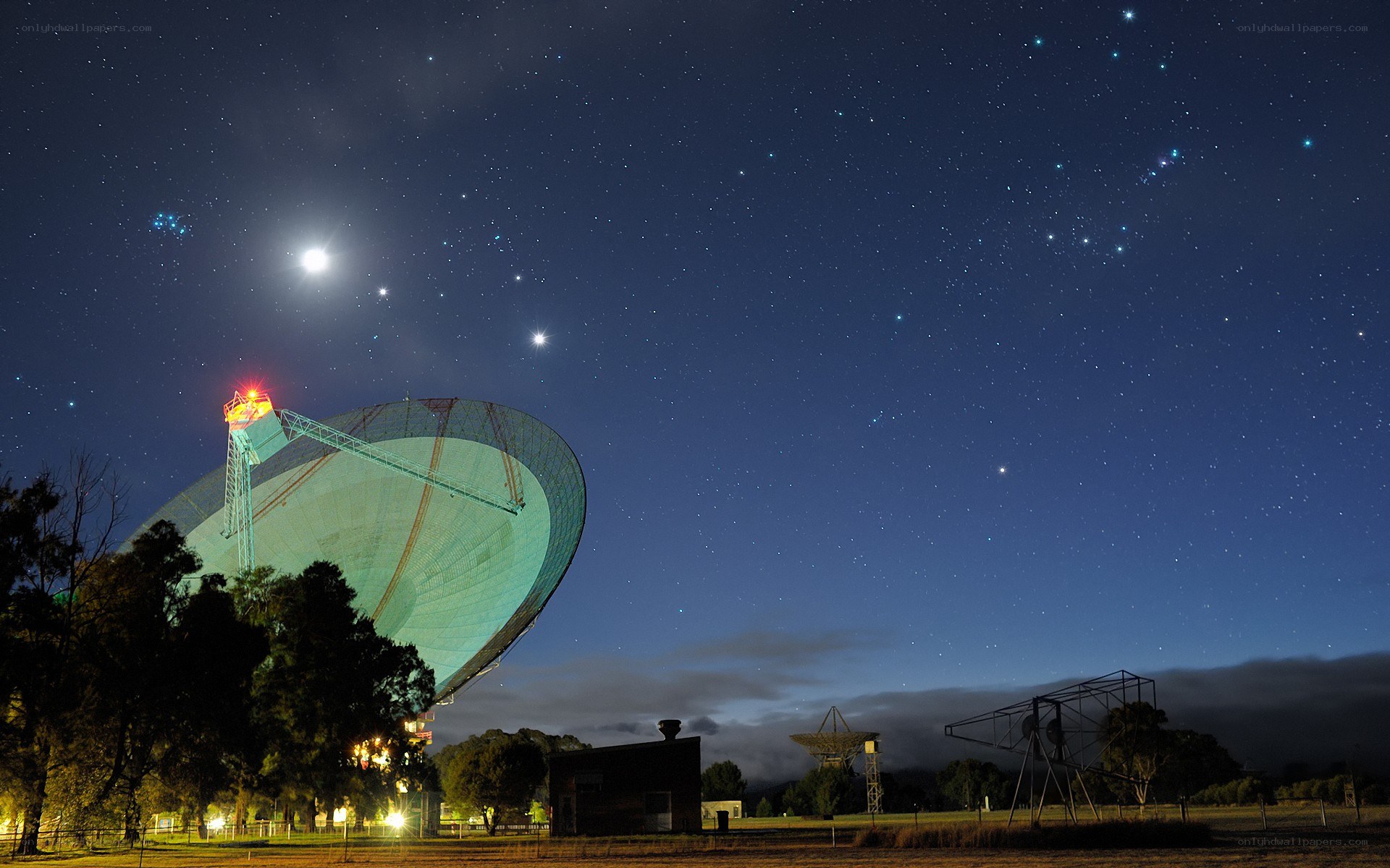 Radio telescope under starry sky