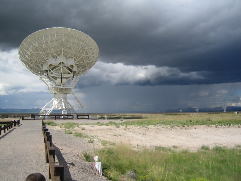 Radio telescope under stormy sky