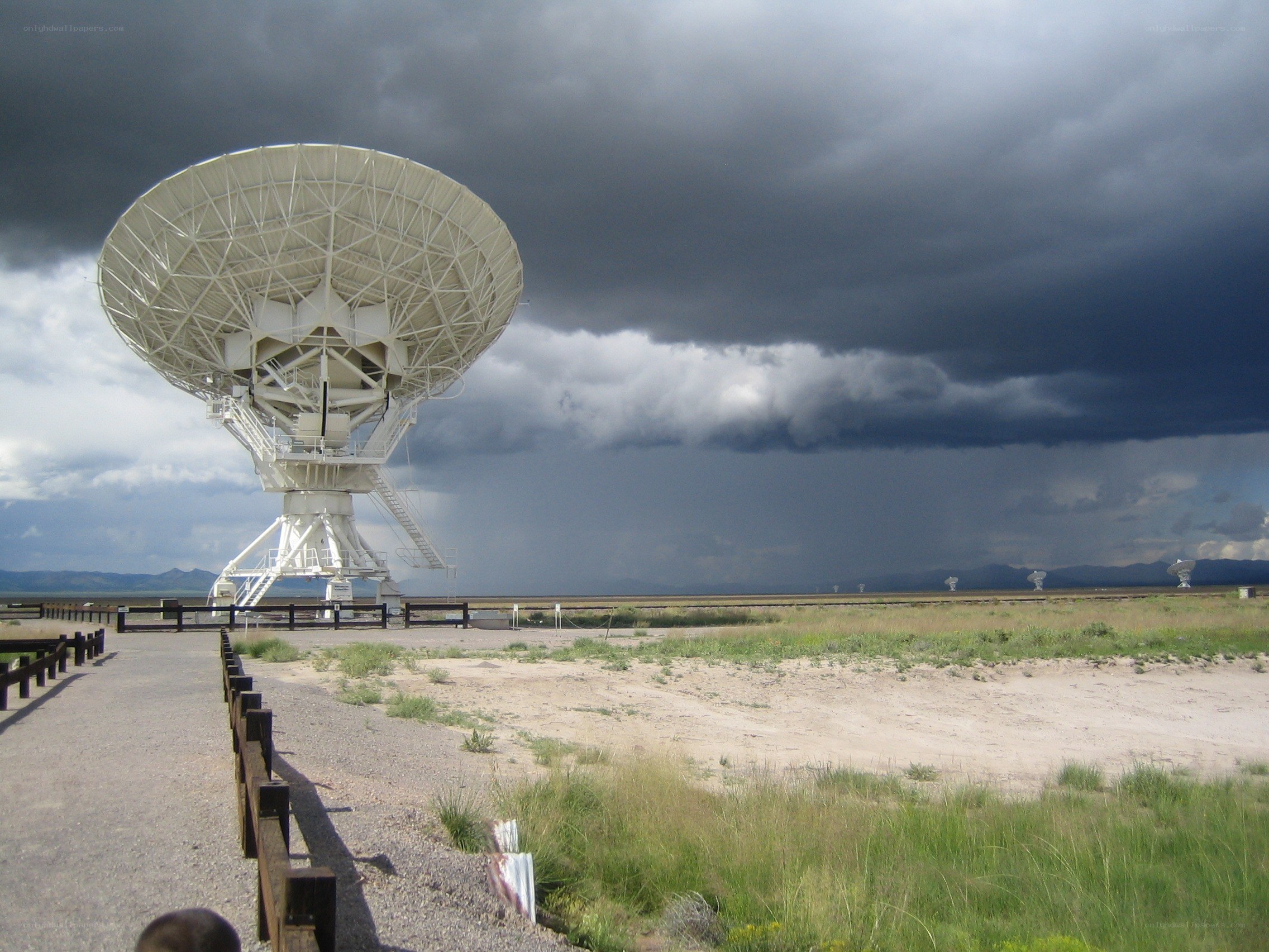 Radio telescope under stormy sky