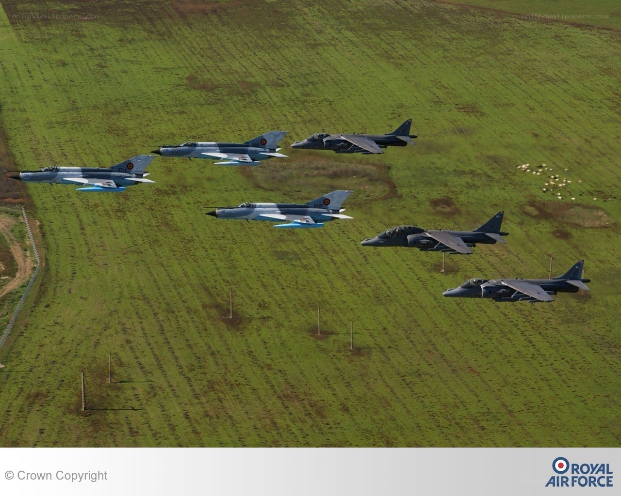 RAF jets in formation over fields