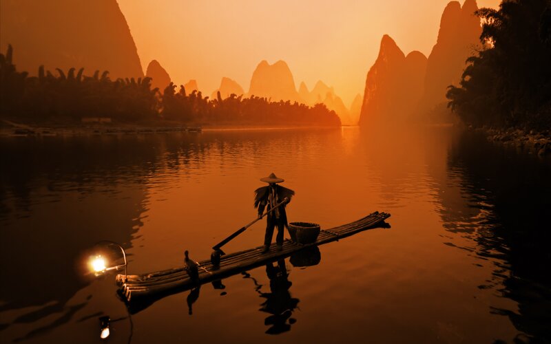 Rafting at sunset in karst landscape