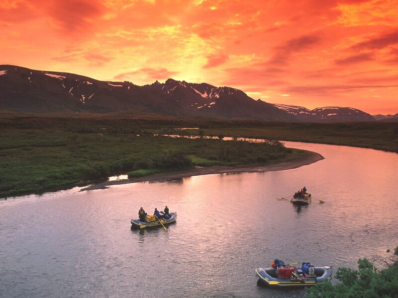 Rafting on a river at sunset