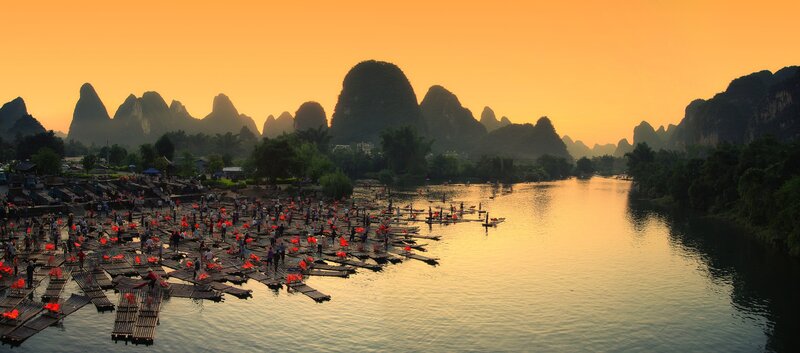 Rafts on River at Sunset
