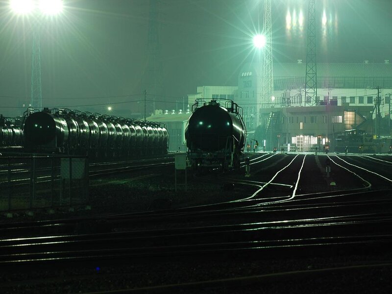 Rail yard at night with tank cars