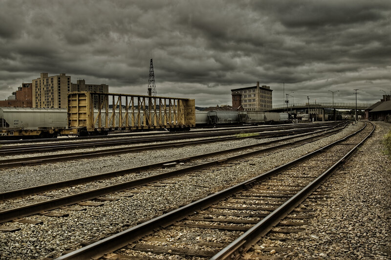 rail yard under stormy sky