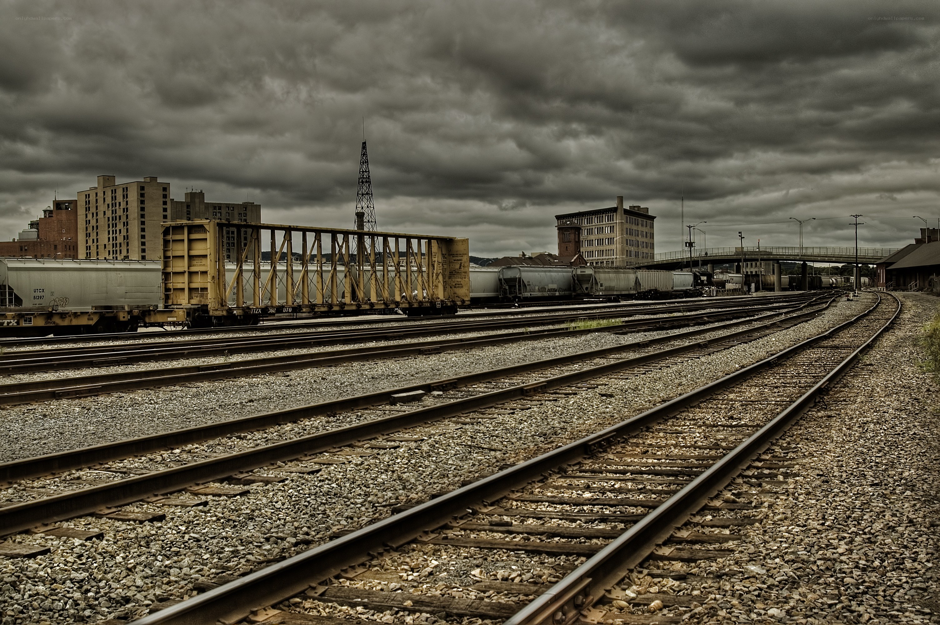 rail yard under stormy sky