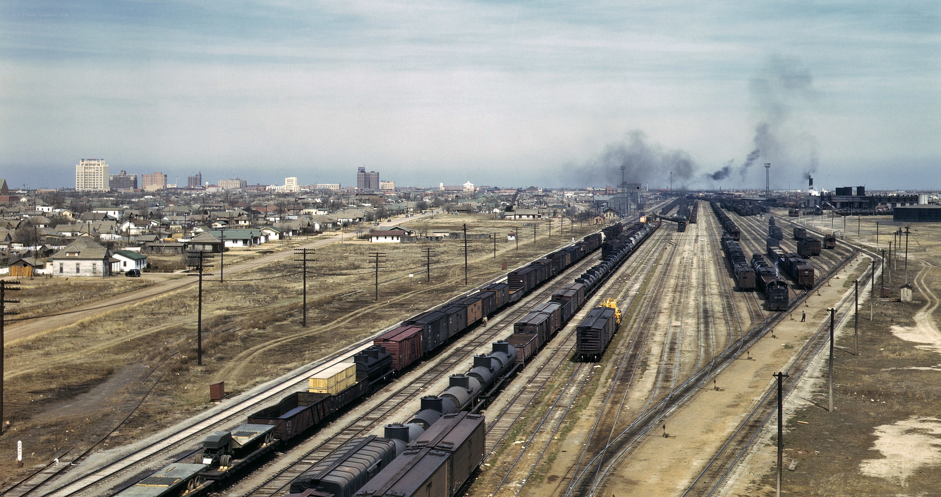 Rail yard with city skyline