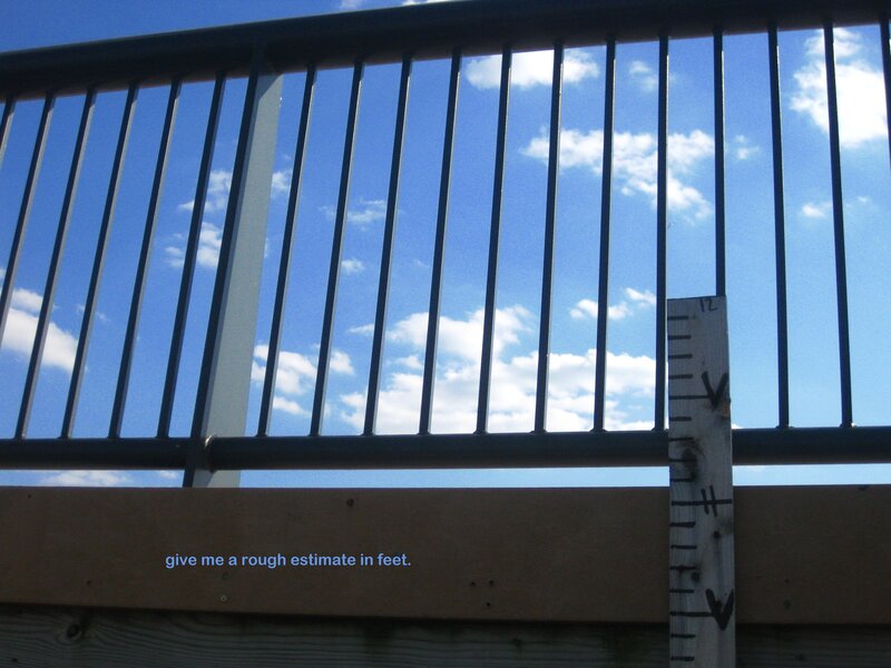 railing with ruler against sky