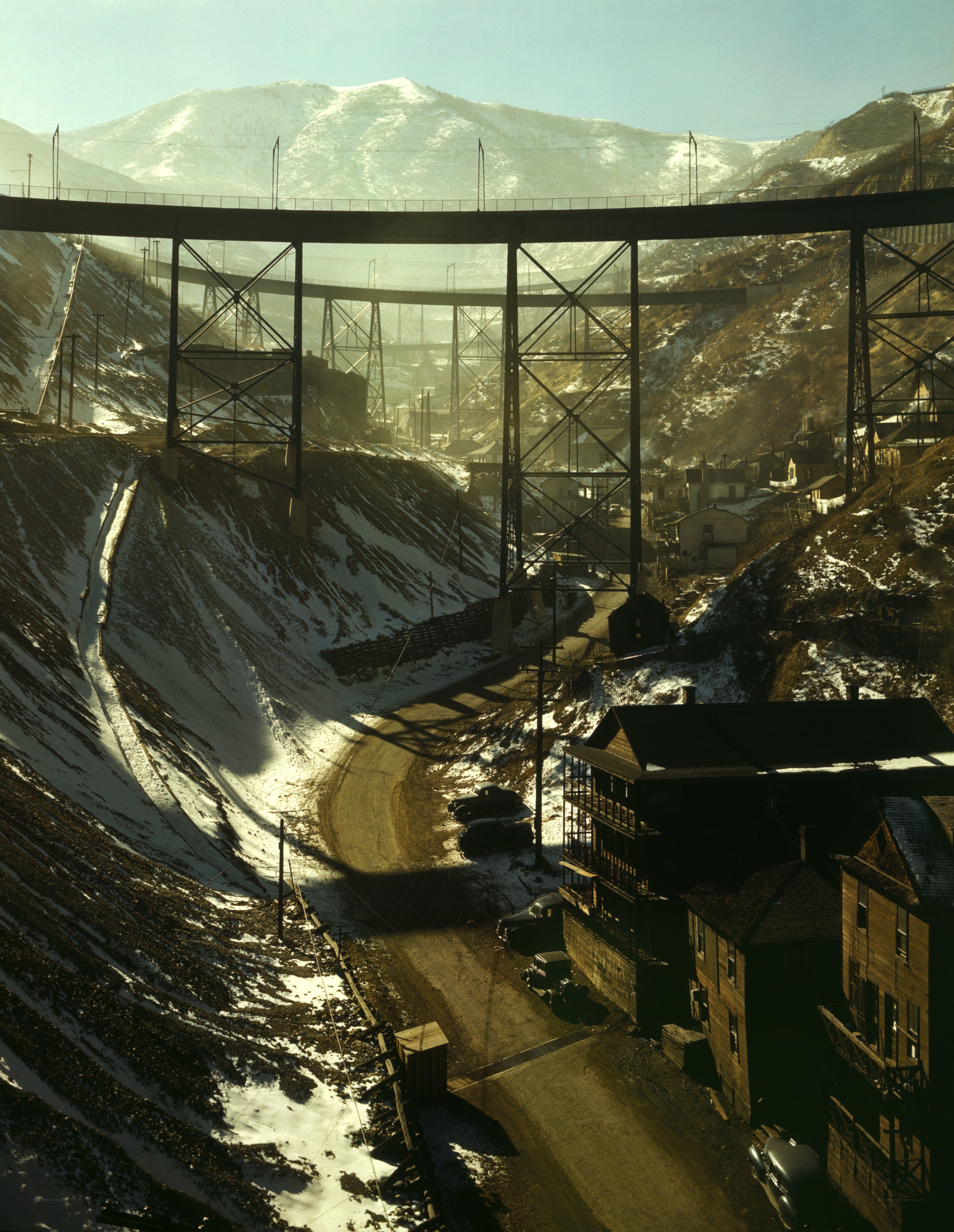 Railroad bridge over snowy valley