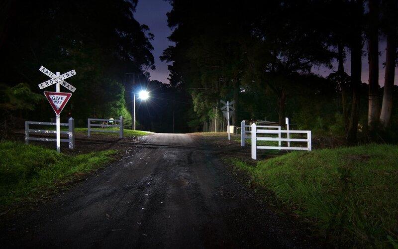 Railroad crossing at night