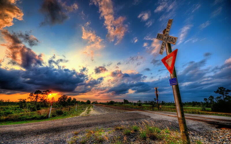 Railroad Crossing at Sunset — Blue