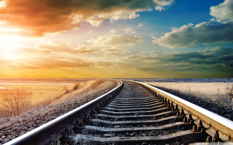 Railroad Tracks at Sunset — Blue, Dramatic, Photograph, Sky, Clouds, Field