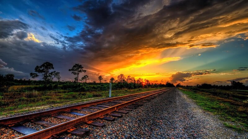 Railroad Tracks at Sunset — Orange, Dramatic, Photograph, Sky, Trees, Gravel