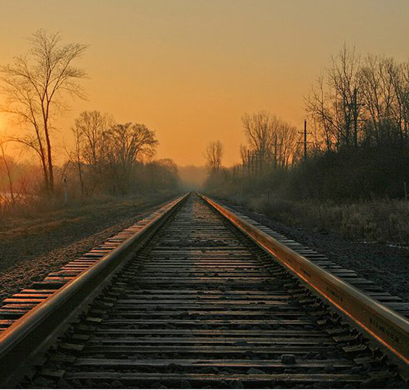 Railroad Tracks at Sunset — Orange, Serene
