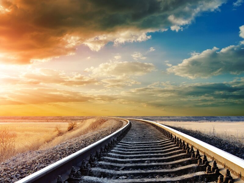 Railroad Tracks in Field — Blue, Dramatic, Sunset