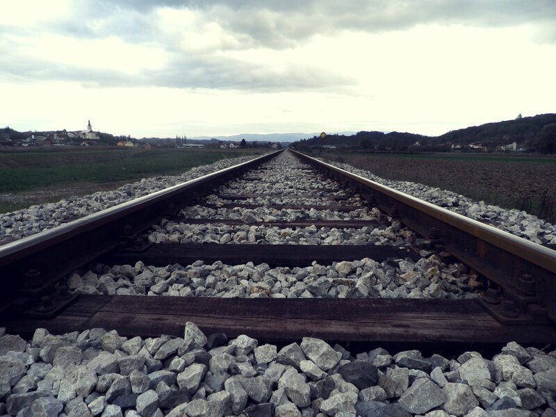Railroad Tracks in Field — Gray, Calm