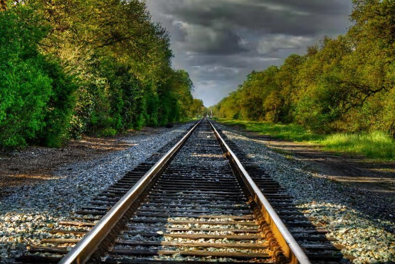 Railroad Tracks in Forest — Green, Dramatic