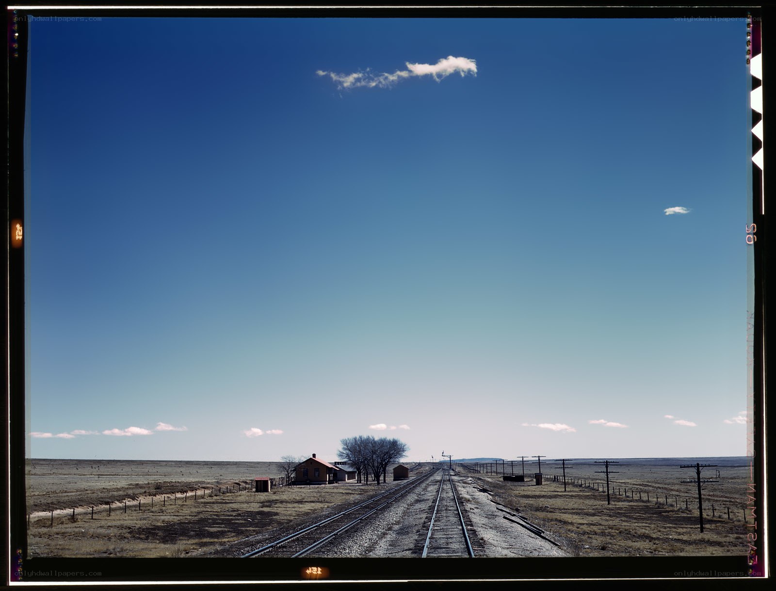 Railroad tracks in open plains