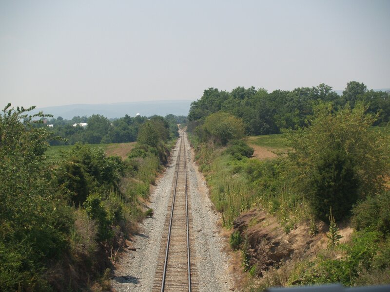 Railroad tracks in rural landscape