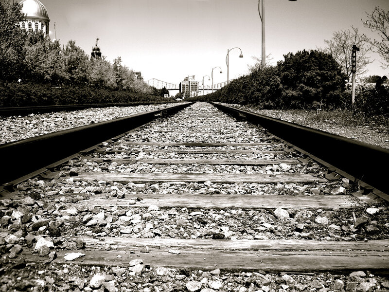 railroad tracks leading to city