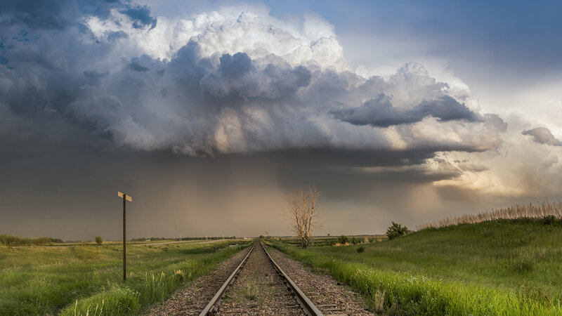 Railroad Tracks under Storm — Green