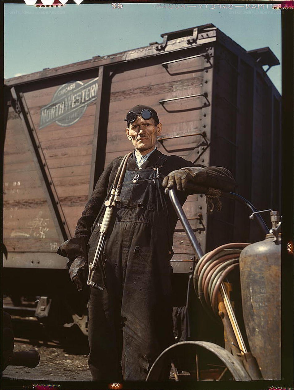 Railroad worker with welding gear