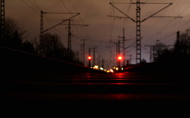 railway at dusk with red lights