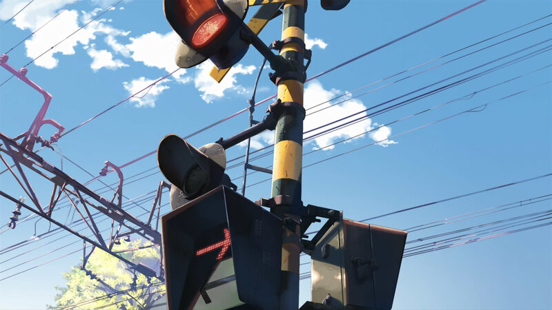 Railway crossing signal under blue sky